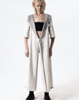 DUALITY 10-way transforming piece: coat / jumpsuit / vest / dress / 4 bags
